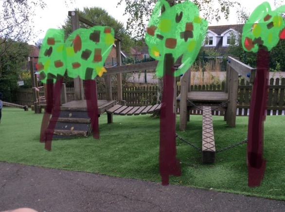 a photograph of a climbing frame with annotated drawings of trees and wildlife on top.