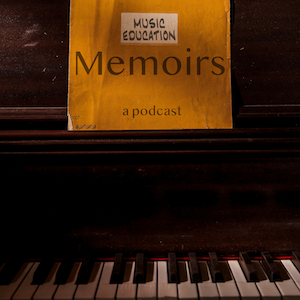 An old piano with a music folder that says Music Education Memoirs. 