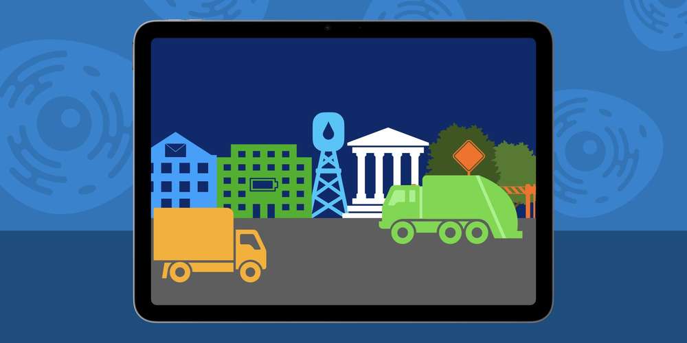 Example of Cell City project on iPad Screen, showing buildings representing parts of a cell and trucks on a road.