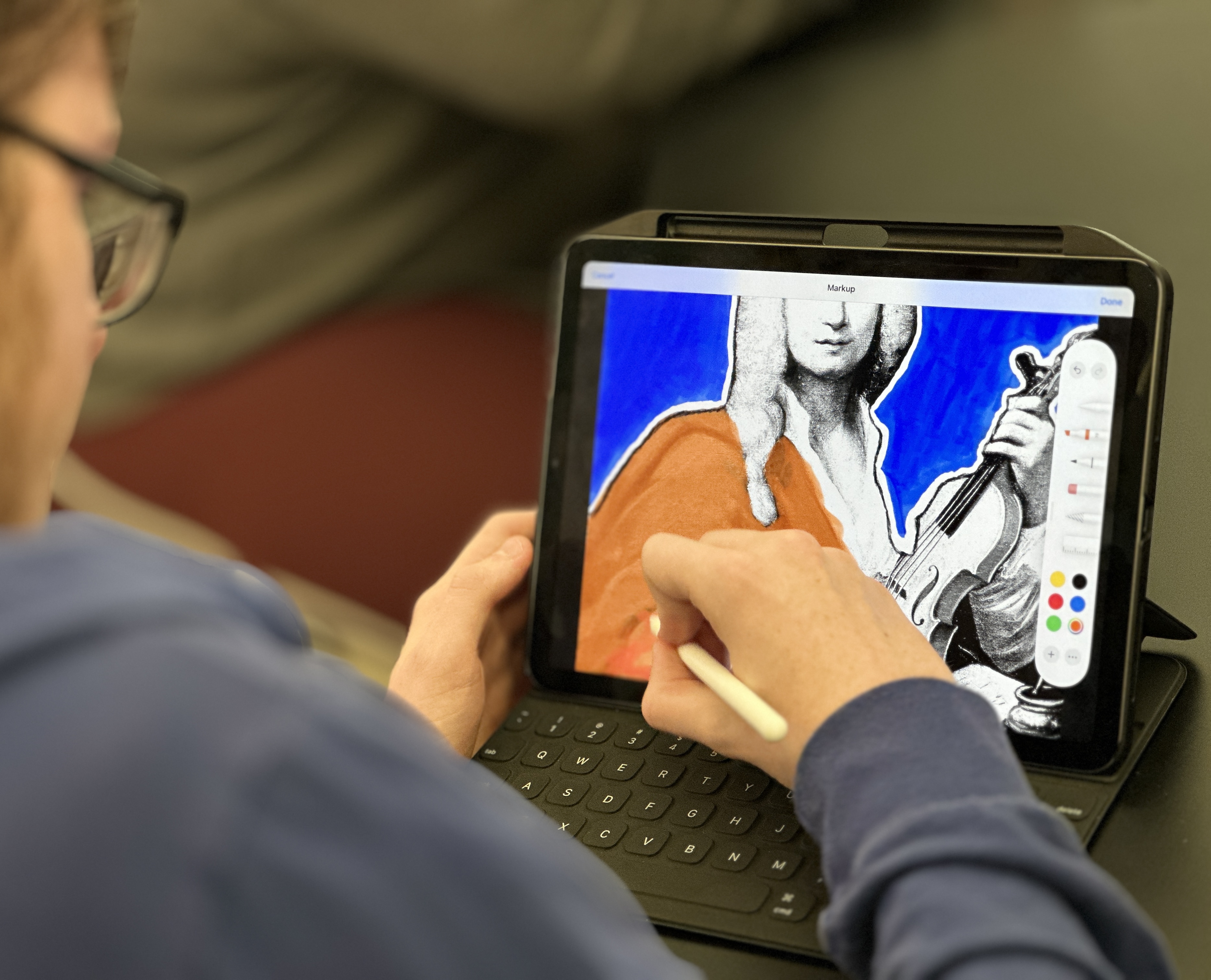 Student coloring an image of a Antonio Vivaldi on her iPad.