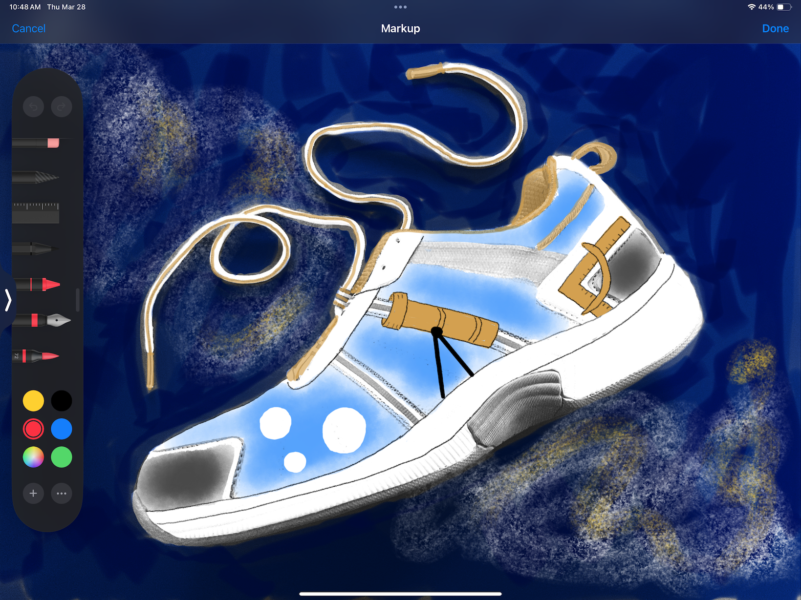 Screenshot of a colored photo of a white athletic shoe decorated with a telescope. On the left side are Markup drawing tools.